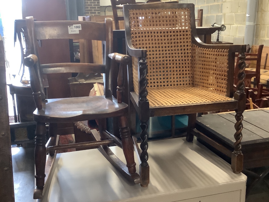 A Victorian mahogany child's rocking chair, height 60cm and a 1920's child's caned armchair, height 64cm